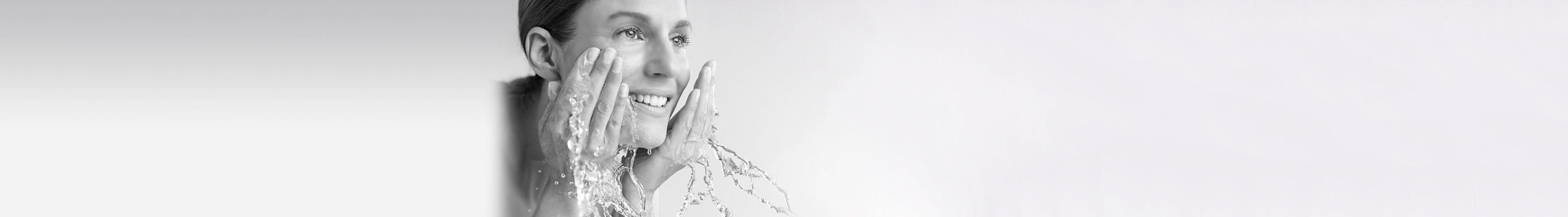 Woman washing her face