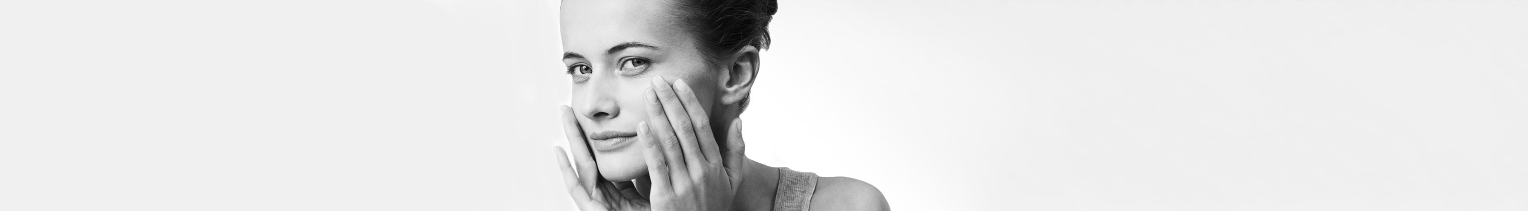 Woman with sensitive facial skin looking in the camera.
