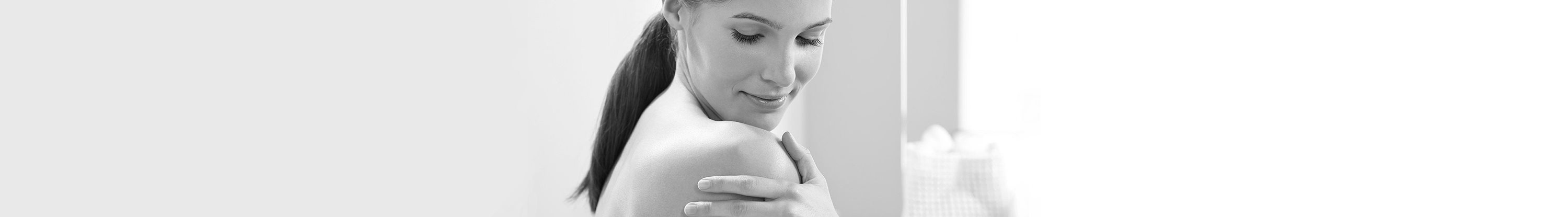 Woman touching her shoulder
