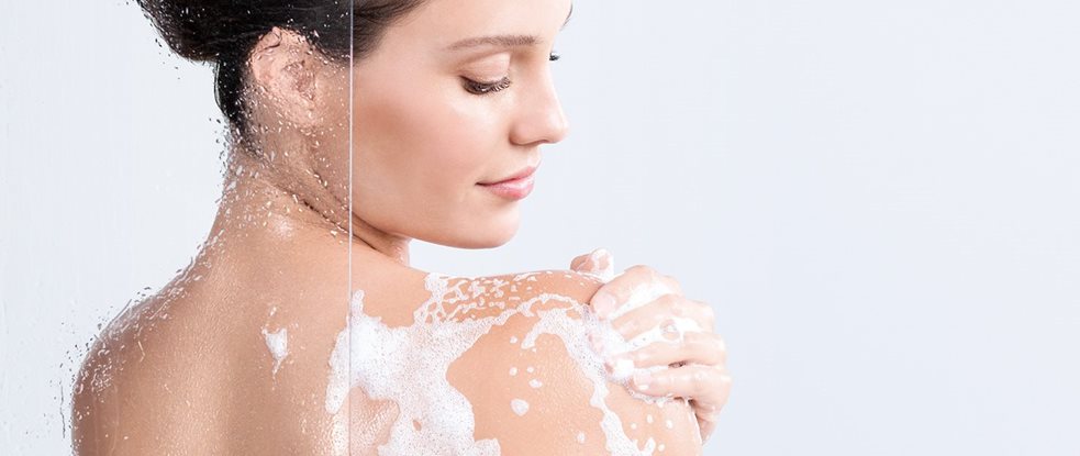 Woman applying cream on her hands