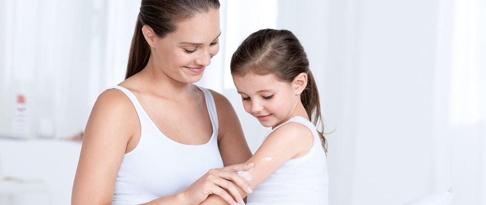 Woman touching her shoulder