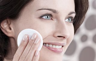 Woman toning her face