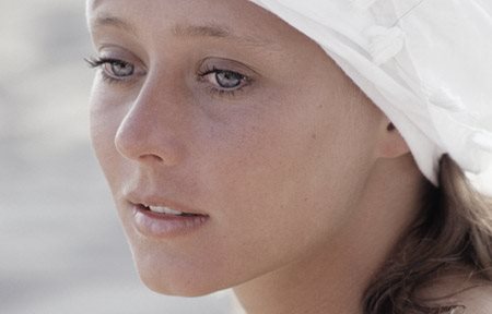 Woman with white headdress.