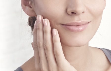 Woman applying Eucerin Hyal-Urea Day or Night Cream