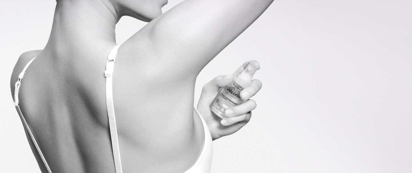 Woman using Eucerin 72 h Anti-Transpirant Intensive Pump-Spray